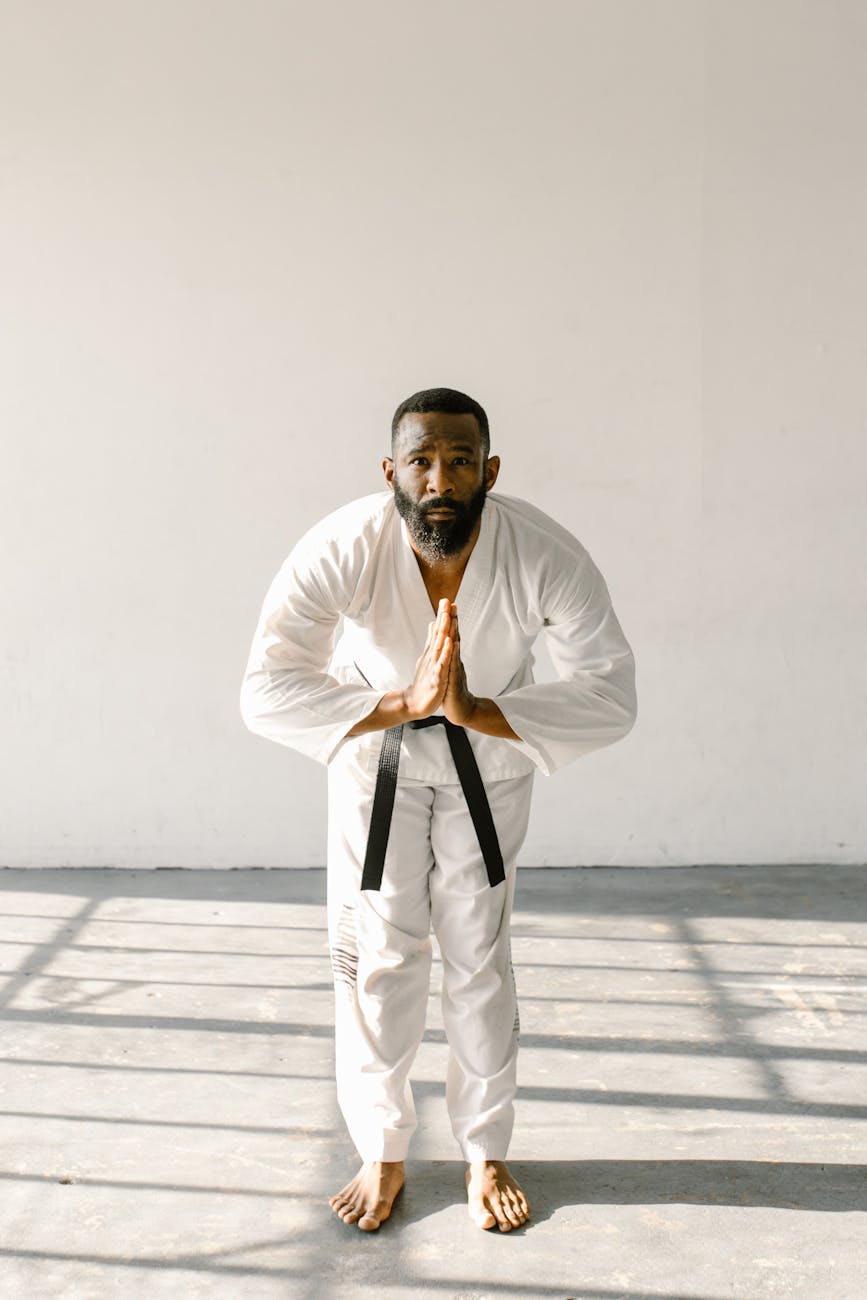 a man leaning forward with his hands together