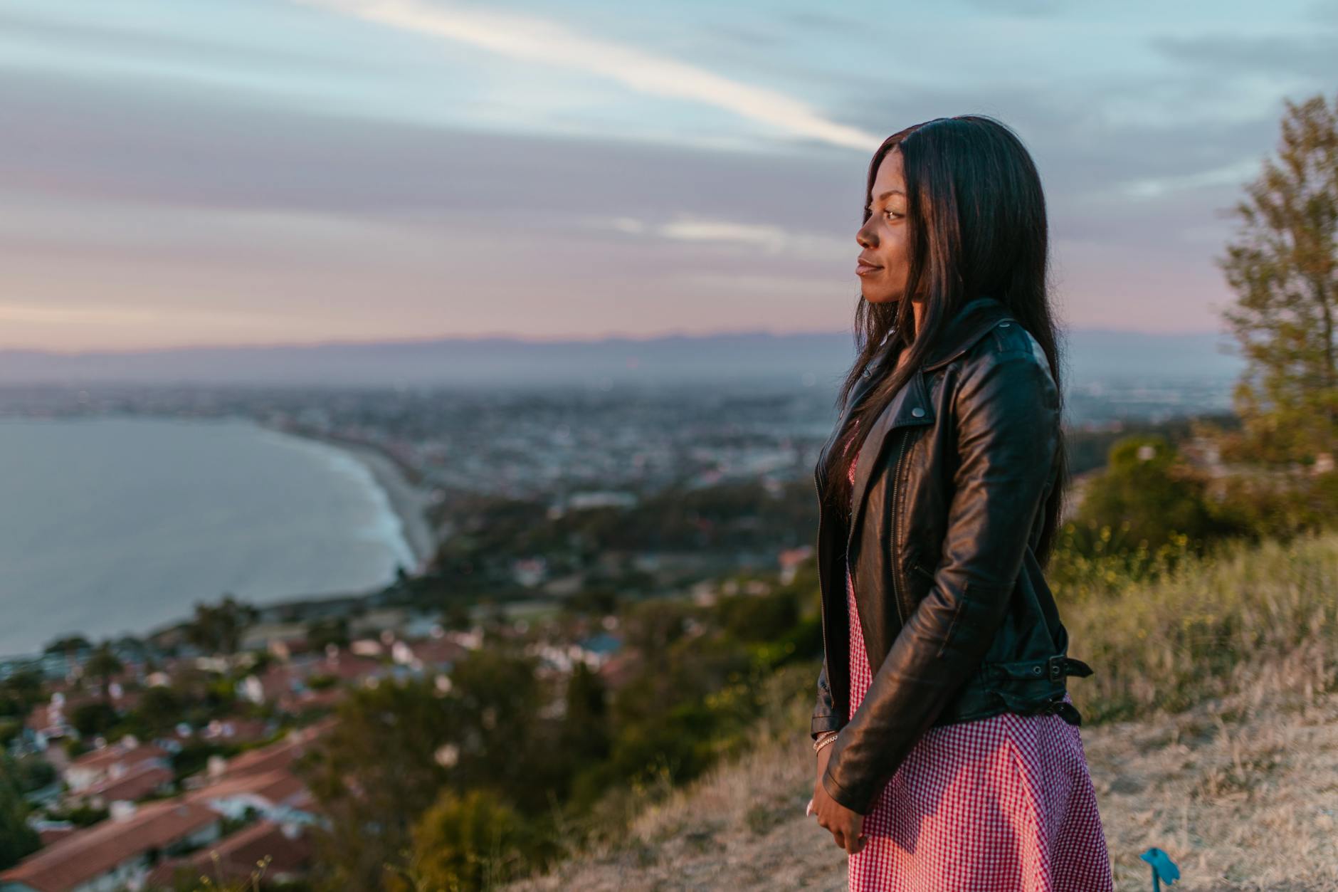 woman in black leather jacket looking away